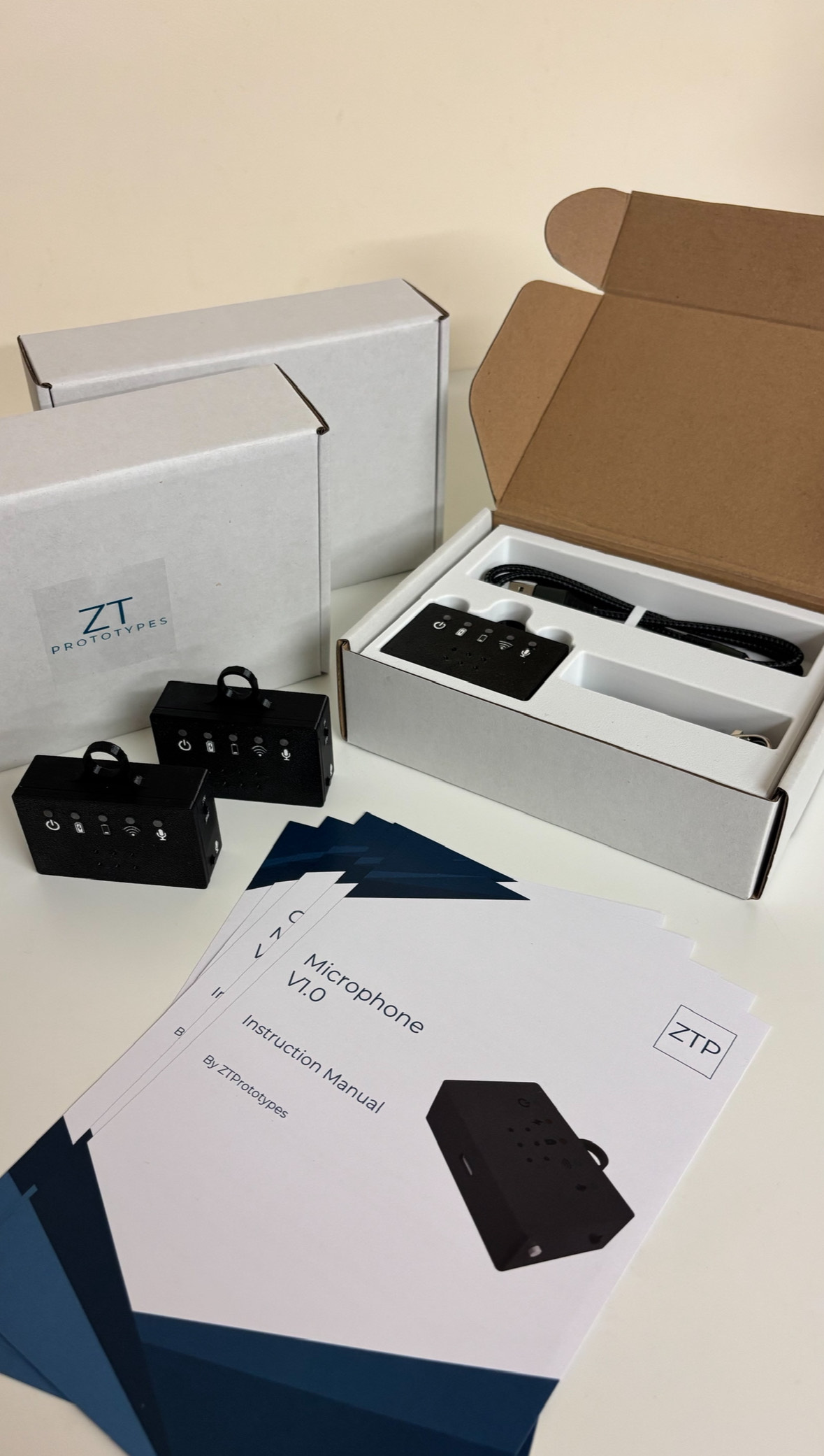 Smart WiFi Microphone units packaged with cable and instruction manual